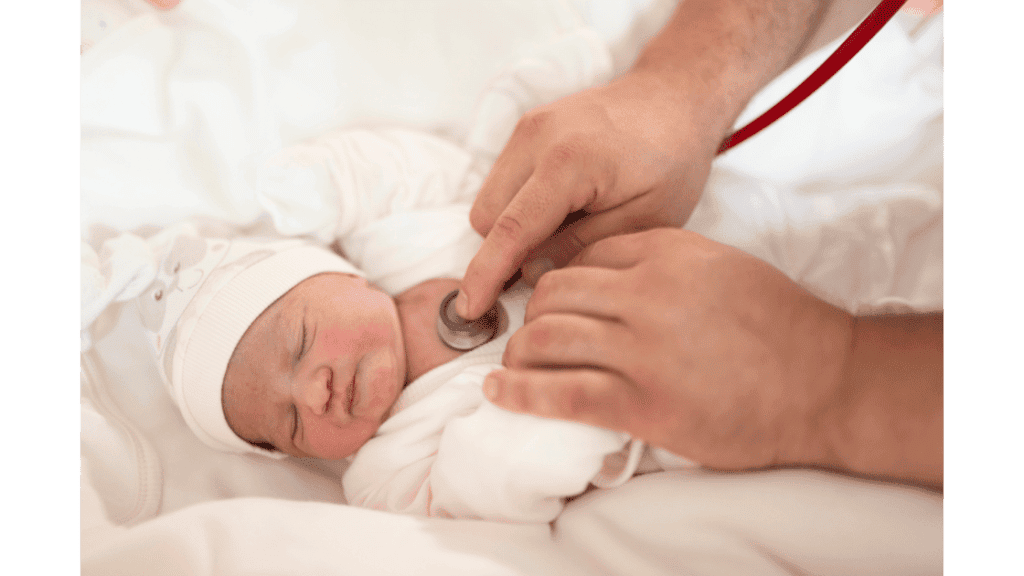 doctor examining a baby