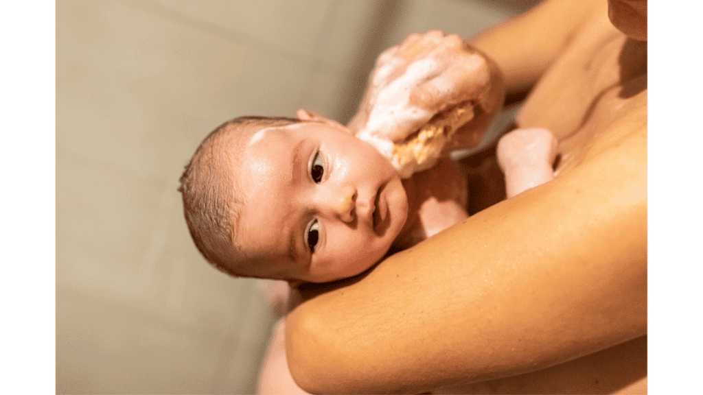 baby taking sponge bath